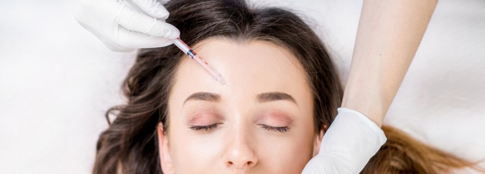 Woman undergoes botox treatment for fine lines confident about starting at the right age to prevent developing and worsening wrinkles with guidance from cosmetic dermatology professionals at North Atlanta Dermatology