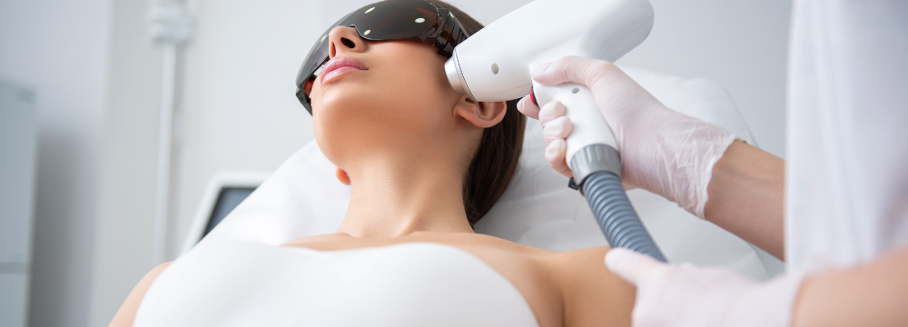 woman receiving laser skincare therapy to treat UV damage