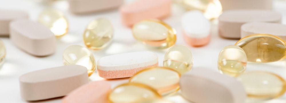 Variety of vitamin supplements scattered on a table